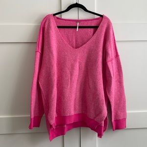 Free People oversized pink V neck sweater.
